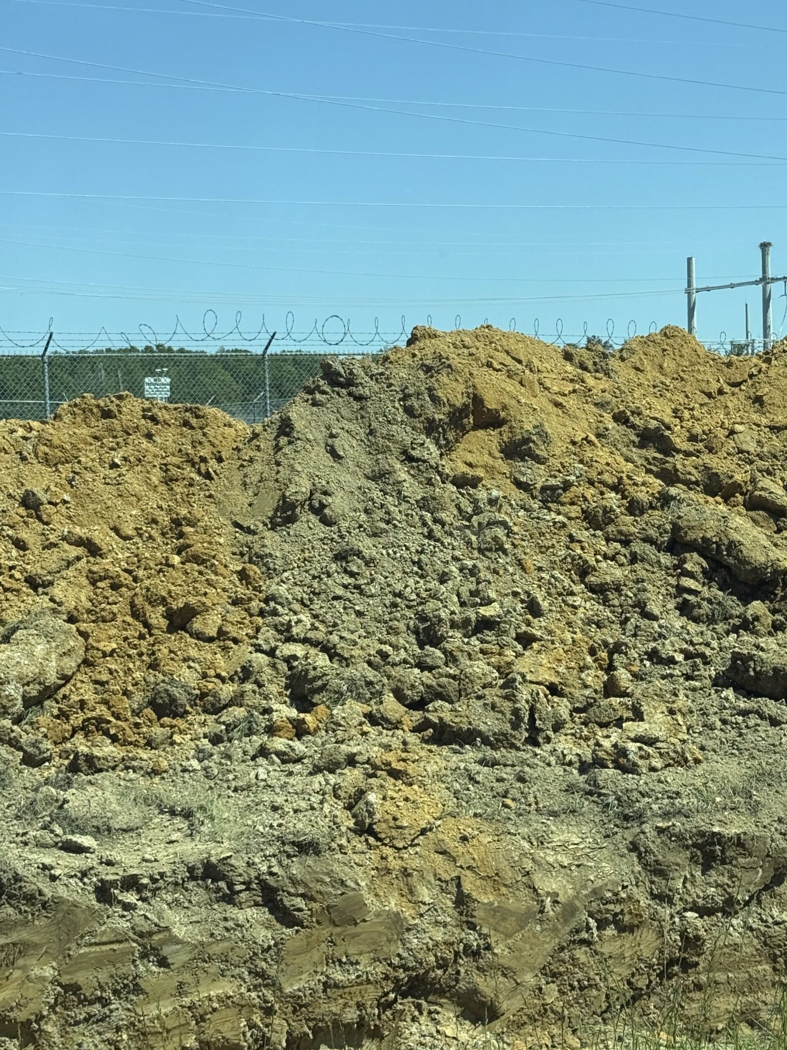 Large mound of unscreened excavated fill dirt