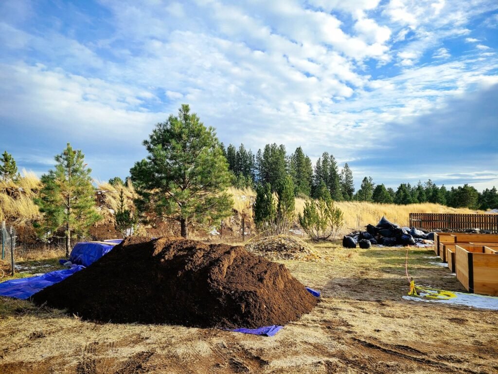 Rich dark screened topsoil ready for bulk delivery